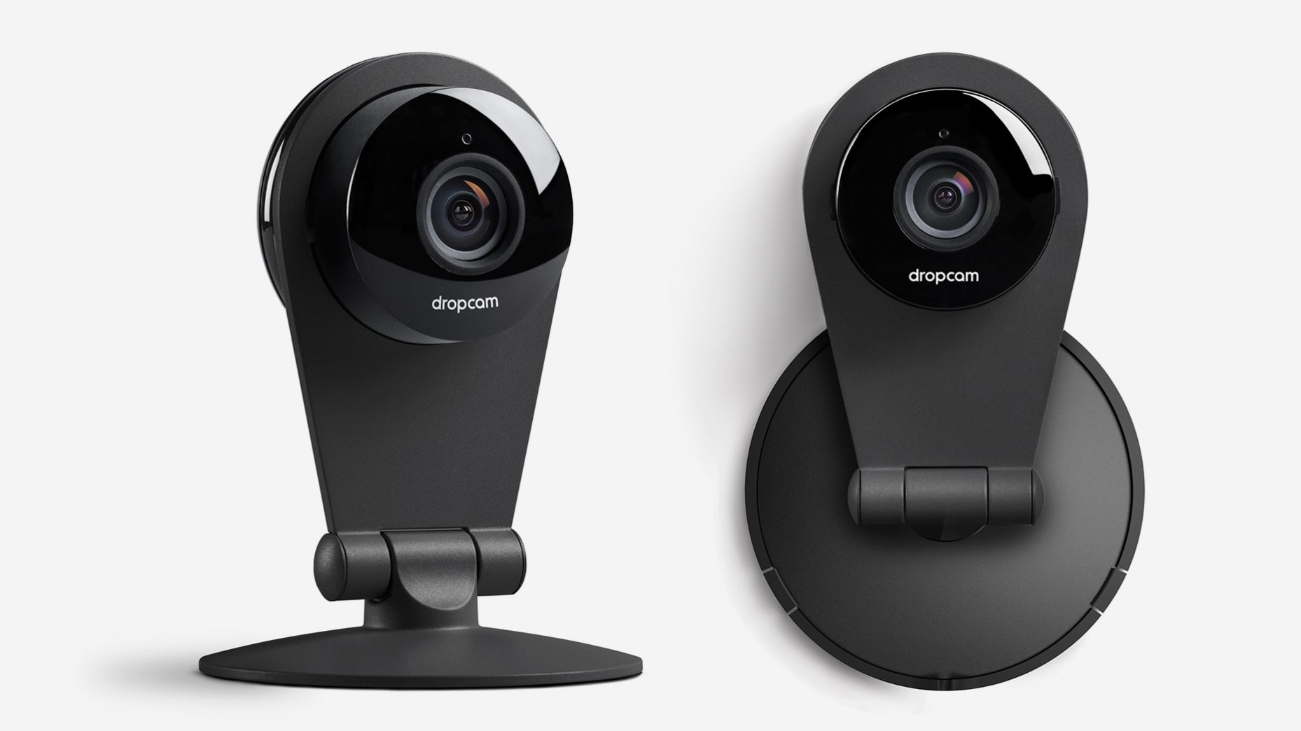 The Dropcam connected home camera, front view on its stand and mounted on its base.
